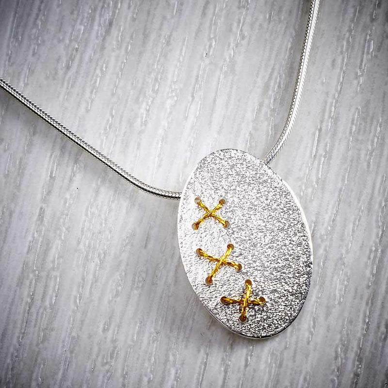 Sewn Silver Oval Cross Stitch Necklace with Gold thread